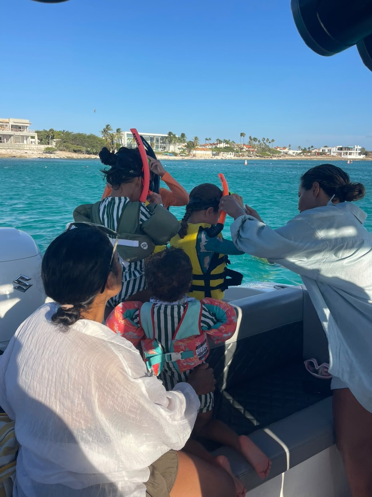 A family getting ready to snorkel on board Aruban Breeze